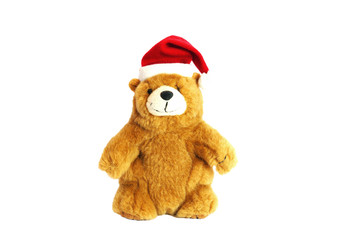 Children's toy teddy bear in the hat of Santa Claus. Isolate on a white background.