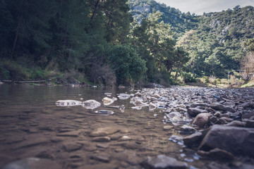 river flowing beside taurus mountains