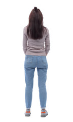 rear view. casual young woman looking white blank screen
