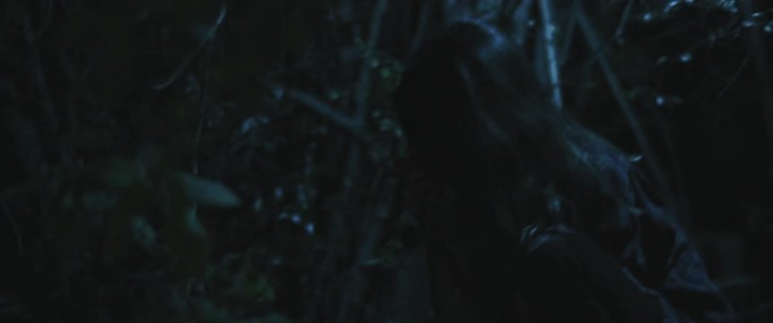Scary zombie creature woman eating human hand in the woods. Close up. BMPCC 4K