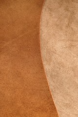 Brown leather.Natural leather texture. Brown beige leather combination background.Smooth and matte...