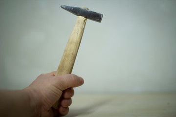 Hammer in hand . The concept of carpentry. Joinery.