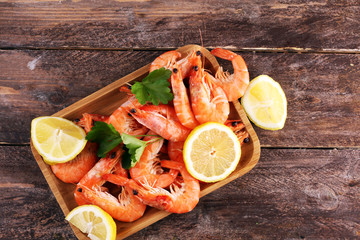 Raw fresh Prawns Langostino Austral. shrimp seafood with lemon and spices on background