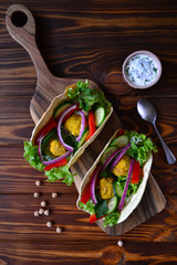 Mexican tacos with vegetables and falafel.