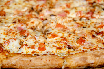 Red piece pizza hand. Cooking food background. Italian food background. Gourmet food. Fresh red pepper. Traditional italian cuisine. Top view. Wooden table.