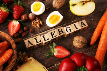 Allergy food concept. Allergy food as almonds, milk, cheese, strawberry, seeds, eggs, peanuts and...