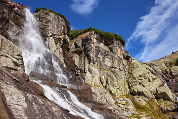 Beautiful mountain waterfall Skok near to Strbske Pleso lake. © andras_csontos