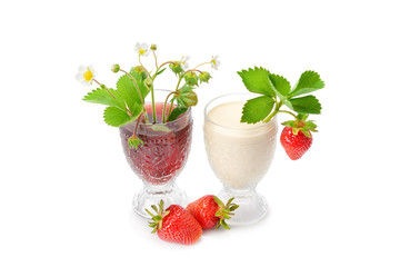 Glass with beverages from juicy and fresh red strawberries and organic milk and beautiful strawberries are around, isolated on a white background.