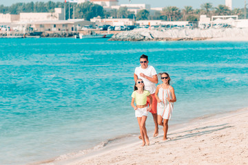 Father and kids enjoying beach summer vacation