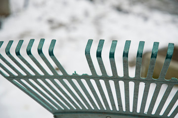 Plastic rake in plastic with broken tines