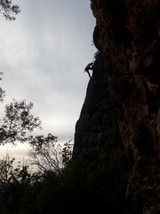 Fototapeta na wymiar silhouette of a climber on an overhanging rock