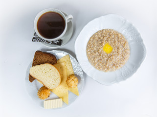 cup of coffee and cake on white background breakfast