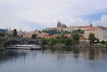 Landscape of Prague, Czech Republic on a sunny day. View of St. Vitus Cathedral. In the foreground...