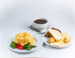 cup of coffee eggs and bread