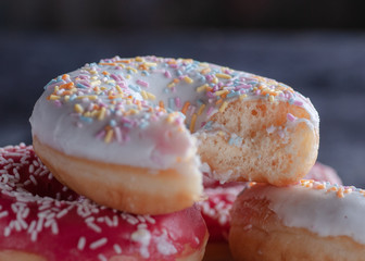 donuts are pink and white in different locations