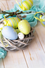 Easter painted eggs on wooden rustic table, holiday background, copy space
