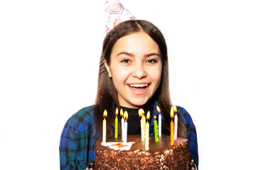 A young Russian girl celebrates her eighteenth birthday. Birthday girl of 18 years with a cake...