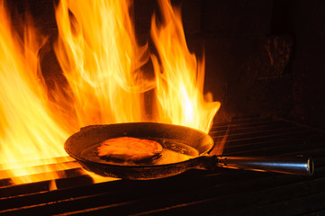 Cooking food in pan in charcoal kiln, Hunneberg, Sweden, Europe