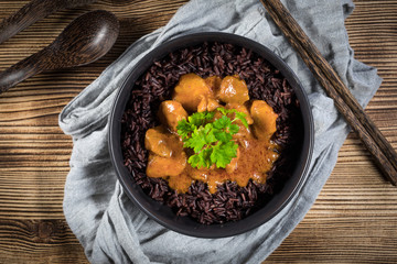 Thai red curry with chicken and black rice.