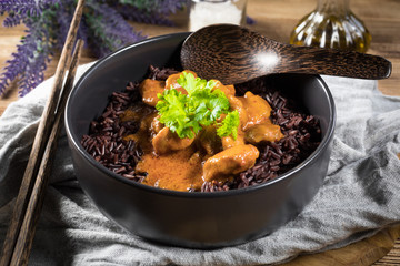 Thai red curry with chicken and black rice.