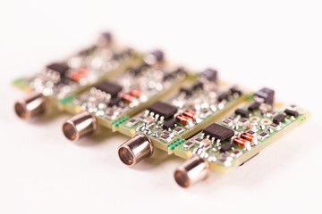 Close-up of four small microcircuits PCB