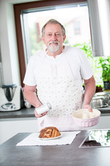 Senior man cooking at home 