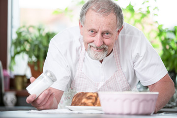 Senior man cooking at home 