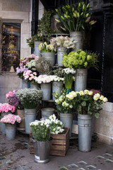 variety of colors near the Liberty store in London. Large bouquets in tin vases. Pink roses
