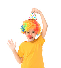 Little boy in funny disguise on white background. April fools' day celebration