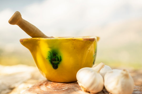 mortar and pestle with herbs and spices