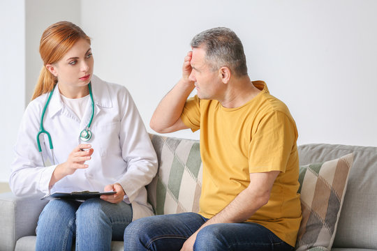Mature man visiting doctor in clinic