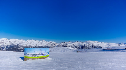 Map on ski slope with names of mountain peaks. Beautiful mountain range covered in snow, Pyrenees, Andorra