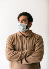 Virus: Man Looks To Side While Wearng Surgical Mask