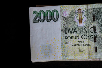 Czech money on a black background. Banknotes of 2000.