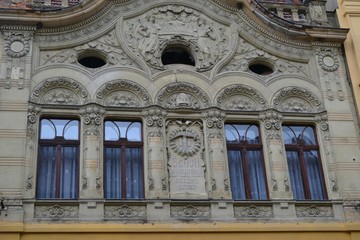  richly decorated facade of a historic building in old town of Brasov, Romania