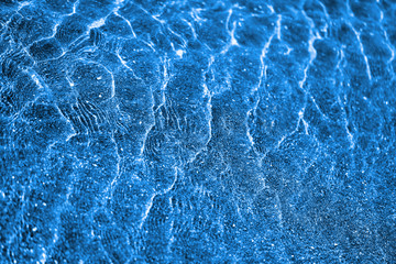 Photo background blue water of the sea