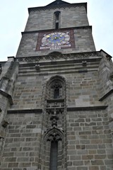 Fototapeta na wymiar The clock tower of the Black Church in Brasov city centre in Transylvania, Romania