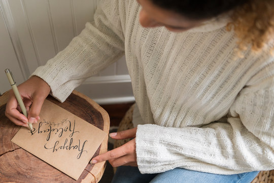 Woman writing on card