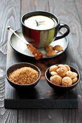 Composition with tea cup and  cookies on wooden tray