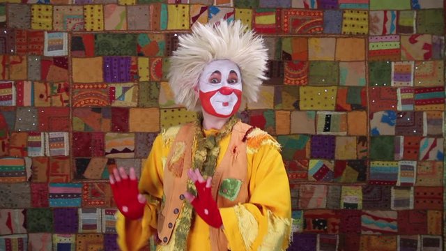 Happy clown dancing with joy moving left and right