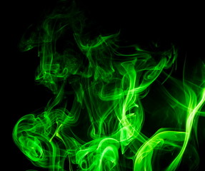 Obraz premium Green smoke on black background