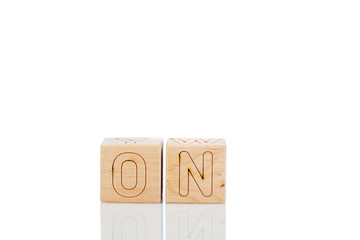 Wooden cubes with letters on on a white background