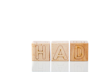 Wooden cubes with letters had on a white background