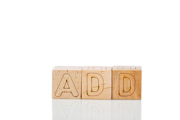 Wooden cubes with letters add on a white background