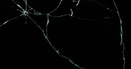 Broken cracks glass fracture effect texture isolated abstract black background. Bullet cracked...