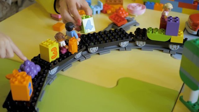 Kids creating robots with teacher. Early development, innovation, modern technology concept