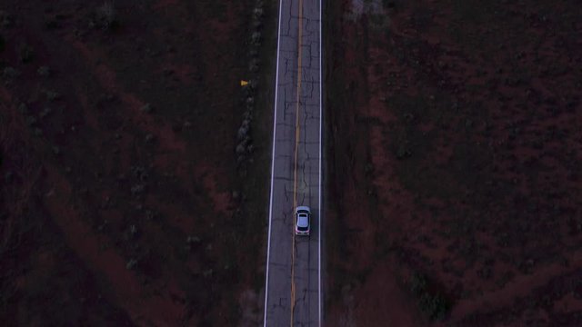 Drone Chasing Car on Deserted Highway in Utah, U.S.A. Aerial View