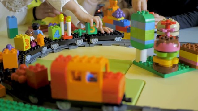 Kids creating robots with teacher. Early development, innovation, modern technology concept