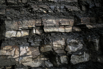 Black rock texture in the Carpathian mountains