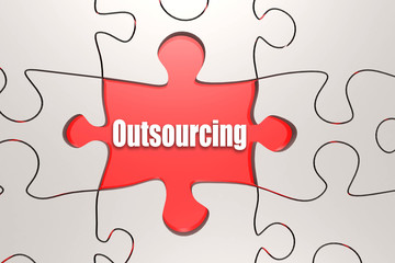 Fototapeta premium Outsourcing word on jigsaw puzzle